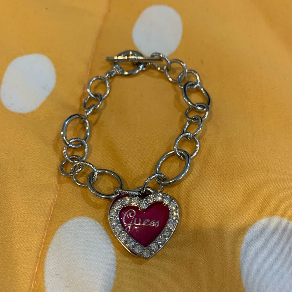 Guess silver charm bracelet with pink heart.